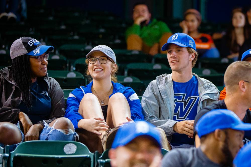 Photo of 3 Grand Valley students in the audience at Comerica Park